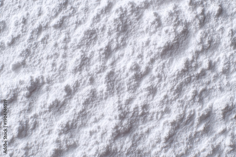 Obraz premium Close view of white powdery substance covering a surface in a winter setting during daylight hours