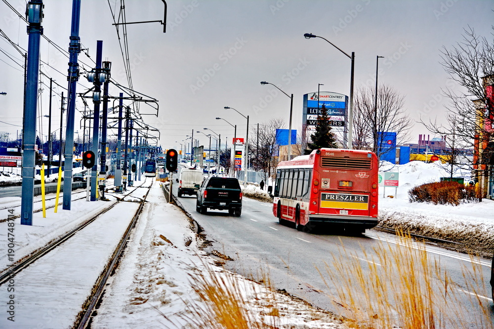 Fototapeta premium Toronto, Ontario, Canada, February 6, 2026: A Metrolinx Eglinton Crosstown LRT test train makes its way along the transit line in Scarborough. This LRT line, after waiting for years to open, is now sc