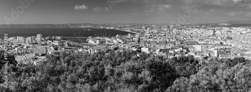 Panoramic aerial view od Marseille old port and its Mediterranean coastline; famous travel landmark city skyline of Marseille, Provence, France in black and white