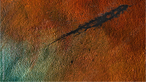 Close-up of a textured surface with a predominantly orange hue and a diagonal black streak across it, against a white background.