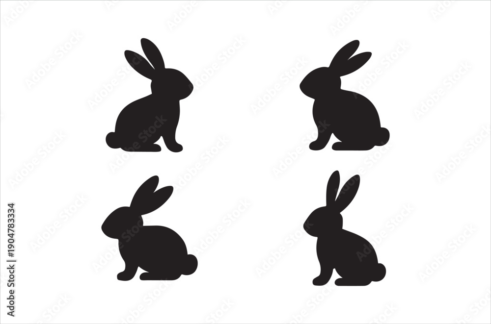 Fototapeta premium Four black silhouettes of rabbits in various seated and alert positions