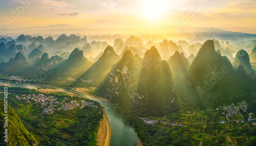 Fotografie Majestic aerial view of karst mountains and Li River at sunrise in Guilin, China