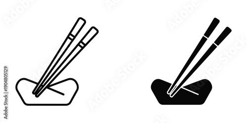 A pair of black chopsticks resting in a white ceramic holder shown in both outline and solid black styles high quality professional detailed modern elegant stylish