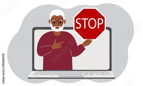 A man holding a red stop sign in a laptop screen. Virus, attack, error, account or page deletion.