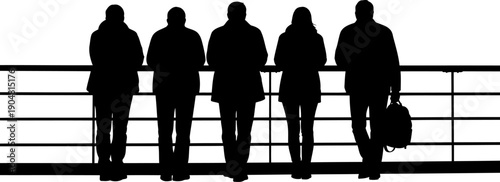 Group of people standing at a railing looking out silhouette