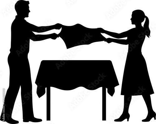 Man and woman spreading tablecloth over a dining table silhouette