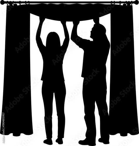 Silhouette of a man and woman hanging new curtains together