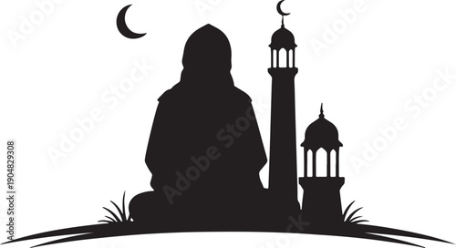 silhouette of a person sitting in front of a mosque at night