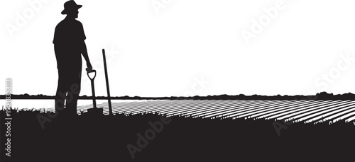 Silhouette of a farmer standing in a field landscape