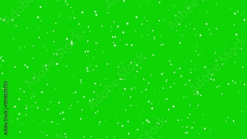 Falling glow particles overlay on green Background. White shine glitter light dust animation. Festive silver particles dust confetti. Celebrate rain dots glitter. Seamless loop motion. 4K video footag