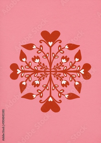 Symmetrical heart design with floral patterns on pink background for decorative art.
