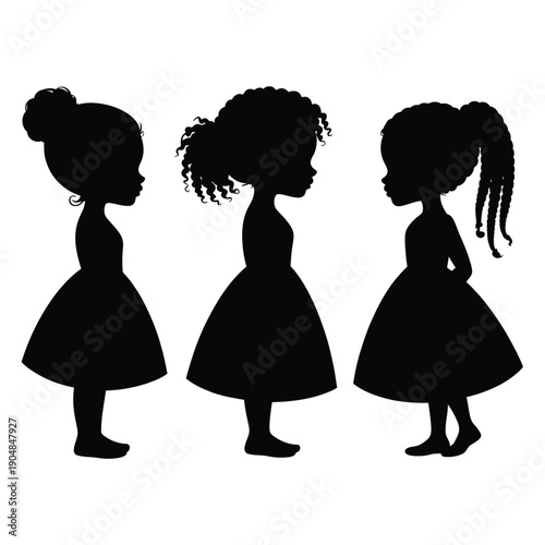 Three young girls stand in silhouette facing each other closely