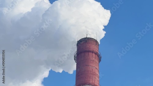 Industrial, ecology and environmental pollution. The smoke from the chimney of the industrial plant.