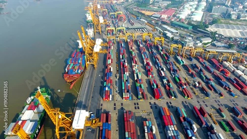 Busy Shipping Port Terminal with Cargo Containers and Cranes Aerial View