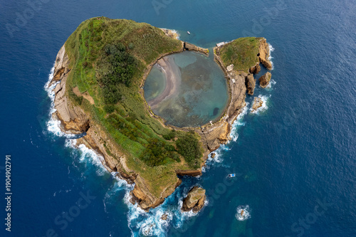 Azores aerial amazing view. Top view of Islet of Vila Franca do Campo. Crater of an old underwater volcano. San Miguel island, Azores, Portugal. Heart carved by nature. Bird eye view.