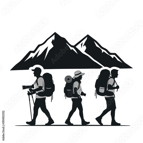 Silhouette of hikers with backpacks walking towards mountain peaks