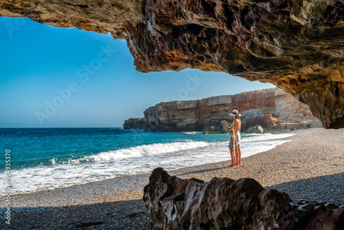 Mother and daughter holding hands on pebble beach at Spilies Beach on Crete