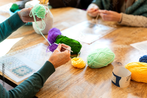 Bilde på lerret People crocheting colorful yarn creating handmade crafts