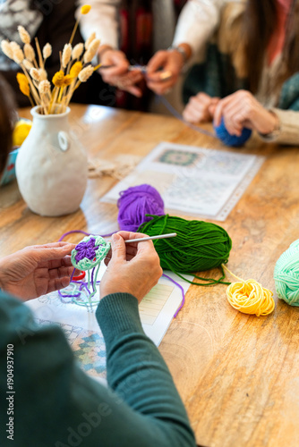 Creating crochet granny square during handmade craft workshop