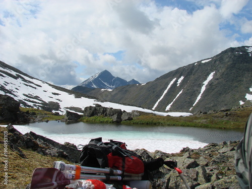 camping equipment on the background of mountains and lakes