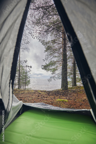 View from the tent to the lake and forest