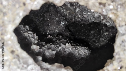 Amethyst geode at the Wanda mines in Misiones, Argentina. Amethysts sparkle in a cleaned deposit in the rocky outcrop.
