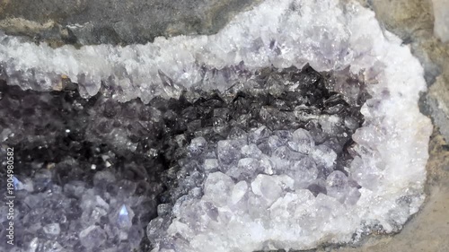 Amethyst geode at the Wanda mines in Misiones, Argentina. Amethysts sparkle in a cleaned deposit in the rocky outcrop.

