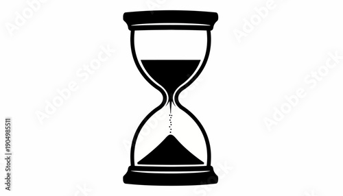 An hourglass sits upright on a flat surface showing sand flowing.