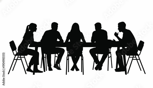 A group of business people sitting around a table discussing kDBkc concepts.