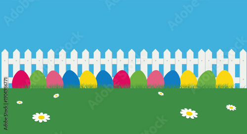 Colorful Easter eggs lined up behind a white picket fence on a sunny day