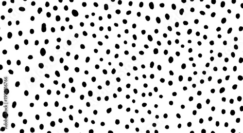 A close-up view of a black and white pattern featuring small dots scattered randomly across the surface