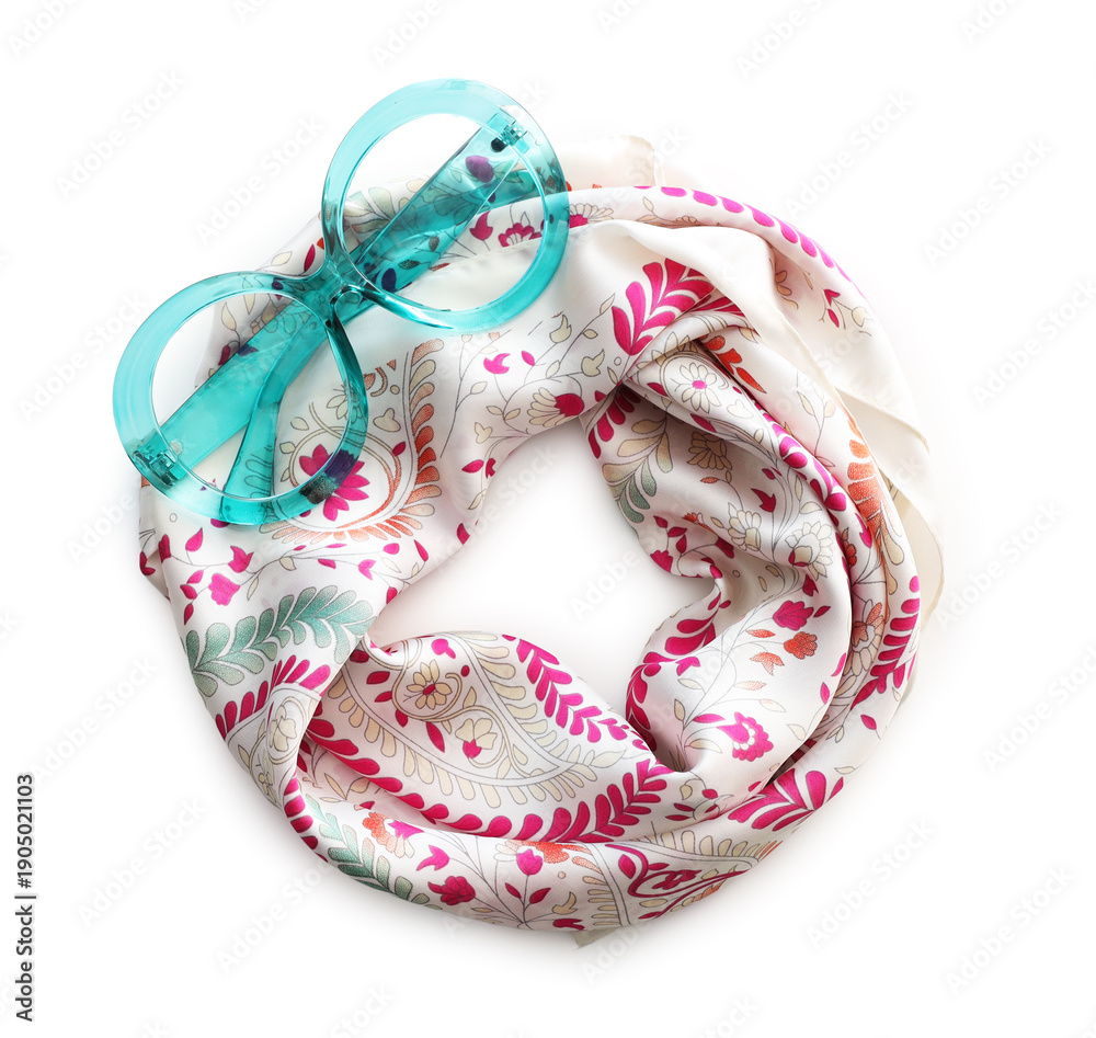 Obraz premium Beautiful handkerchief with pattern and sunglasses isolated on white, top view