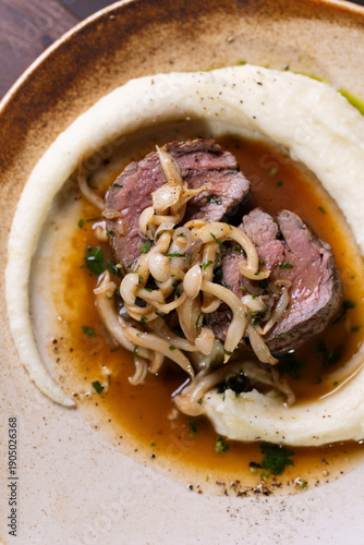 Photos Sliced beef steak with caramelized onions and creamy puree
Restaurant style beef