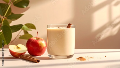 A refreshing and healthy apple cinnamon smoothie with fresh red apples and a cinnamon stick, perfect for a nutritious breakfast or snack