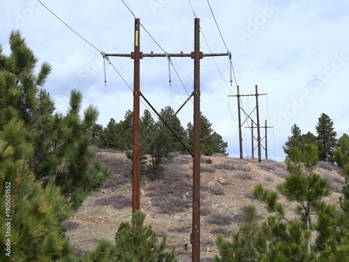 High Voltage Power Lines Crossing Colorado Foothills Landscape in Early Spring