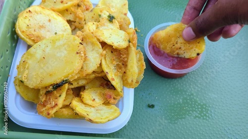 Crispy Kenyan Potato Bhajia: Indian-Inspired Street Food, Deep-Fried Golden Brown Battered Potato Slices from East Africa Served With Chutney Dipping