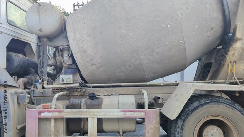 Industrial Concrete Mixer Truck Rotating Slowly: Heavy Duty Cement Transit Mixer Drum Spinning on Construction Site for Infrastructure Development