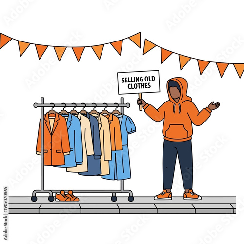 Man selling old clothes at a street market with a rack of clothing displayed
