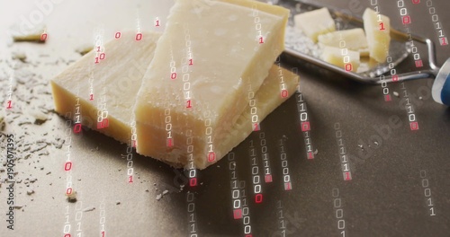 Showing Parmesan wedge shards crumbs sitting on dark counter with metal plane handle binary overlay
