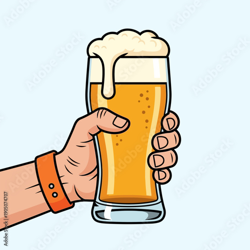 Man's hand raising a glass of golden beer topped with frothy foam