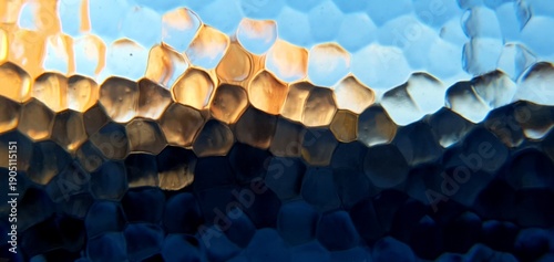 Abstract frosted glass with techno futurism light refraction. Modern honeycomb geometric pattern and blue gold bokeh distortion, ideal for futuristic technology and web backgrounds