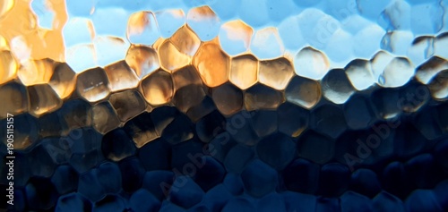 Abstract frosted glass with techno futurism light refraction. Modern honeycomb geometric pattern and blue gold bokeh distortion, ideal for futuristic technology and web backgrounds