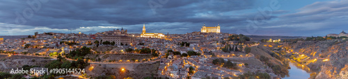 Panoramic View of Toledo at Dusk with Illuminated Alcazar and Cathedral