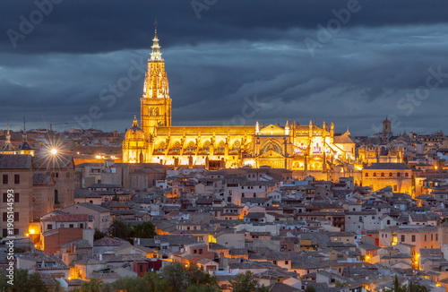 Illuminated Toledo Cathedral Above Rooftops at Dusk, Spain