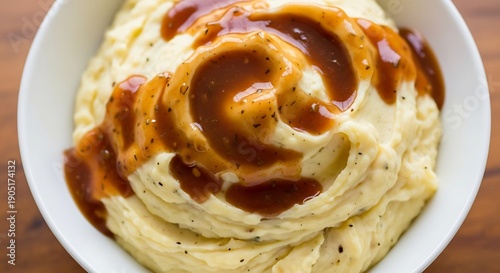 Mashed Potatoes with Gravy in White Bowl.