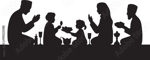 Family of five sitting at a table with hands clasped in prayer