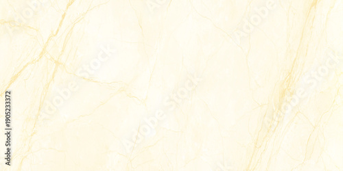 A close up view of a creamy beige marble texture with delicate golden veins running throughout the stone surface