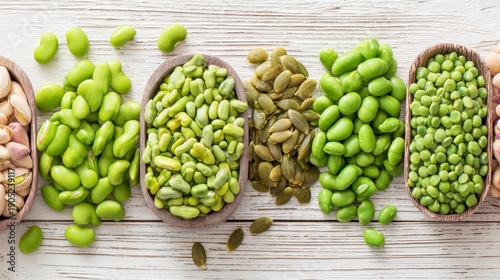 Assorted Green Nuts and Seeds Spread Across Rustic Wooden Surface at a Natural Food Market