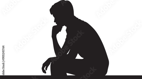 Silhouette of a person sitting with head resting on hand