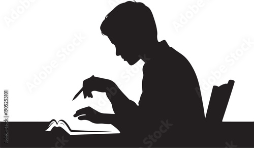 Silhouette of person writing in open book at desk